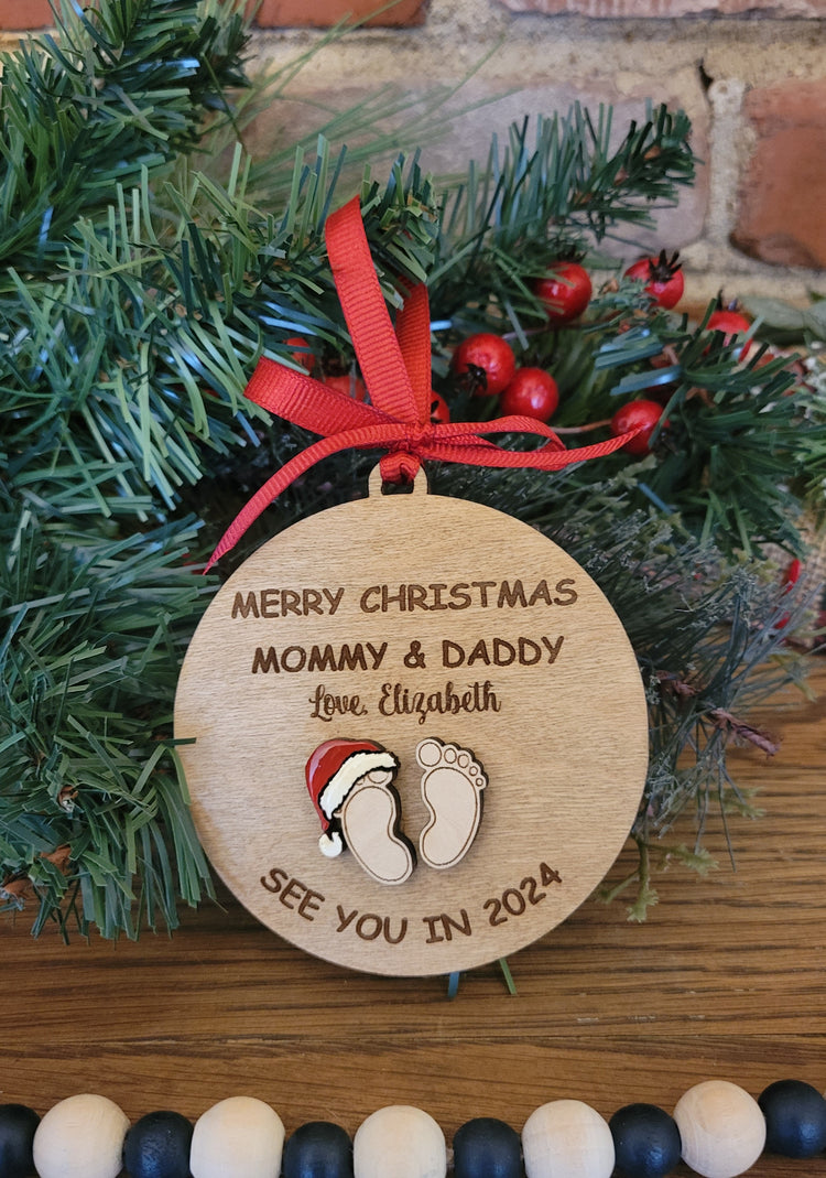 Christmas ornament from baby to expectant mom and dad